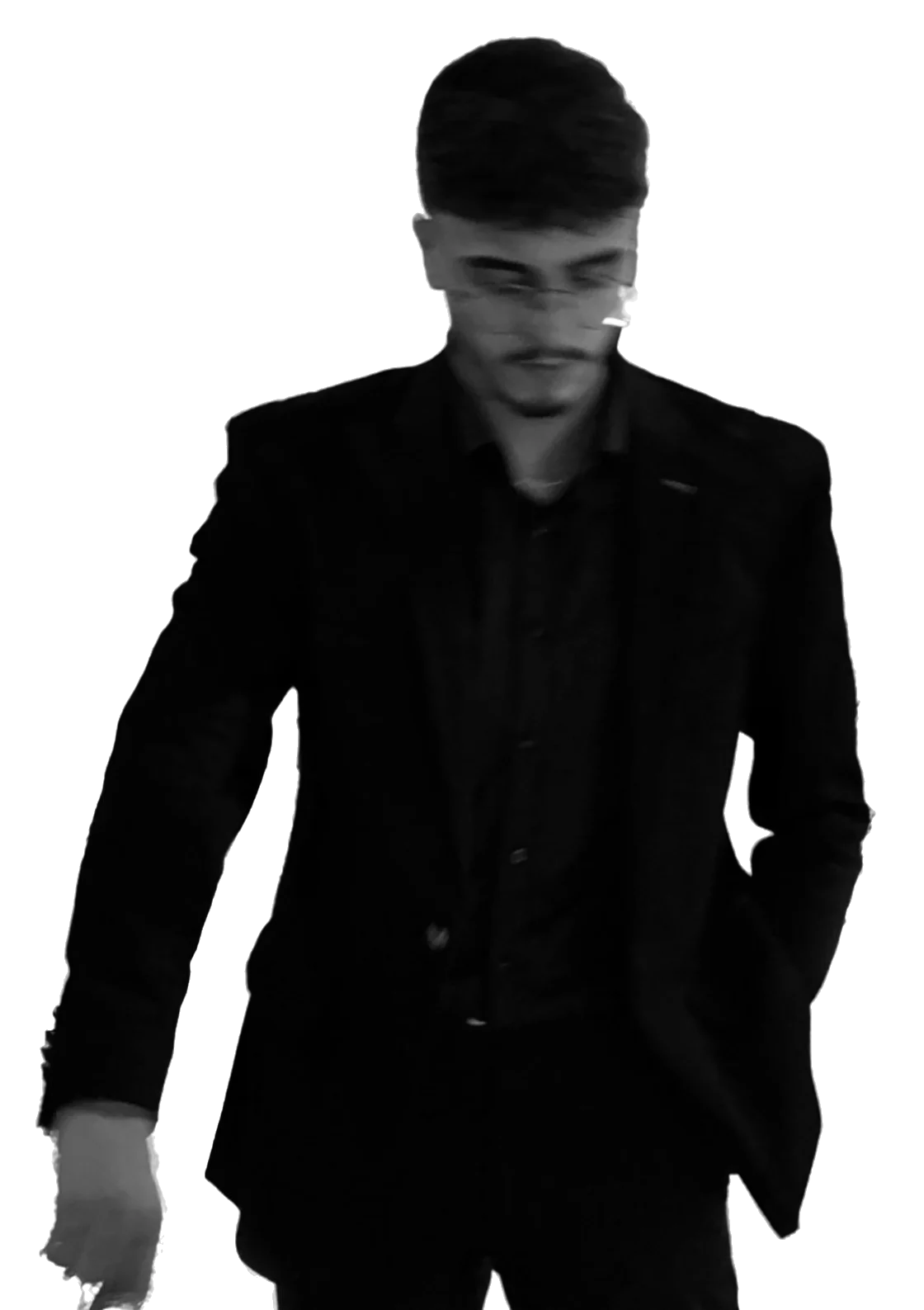 Hagop Jako in a black suit, looking down